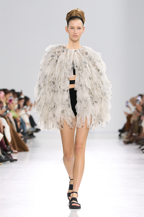 Max Mara Spring/Summer 2026 Fashion Show - Feather jacket and shorts.