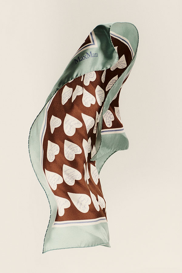 Detail shot of the light blue Max Mara pure printed silk twill foulard, with all-over print.