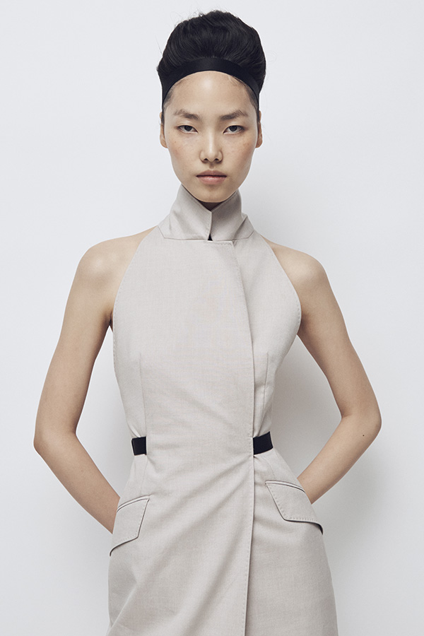Max Mara Spring/Summer 2026 Fashion Show - Model with Sleeveless white Trench Coat Look.